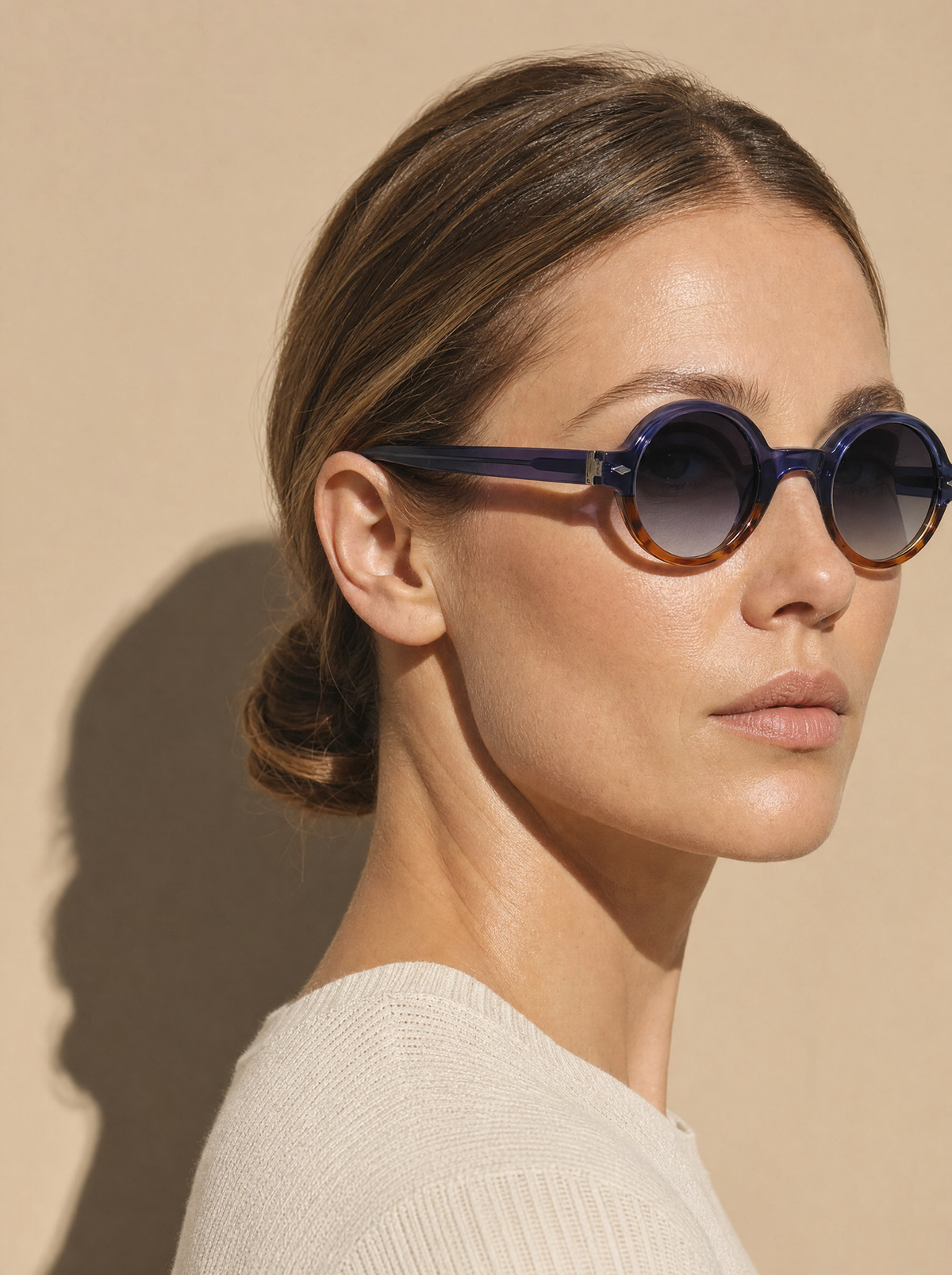 PENNY Frame 07 round sunglasses in MIDNIGHT translucent indigo over tortoise, three-quarter portrait