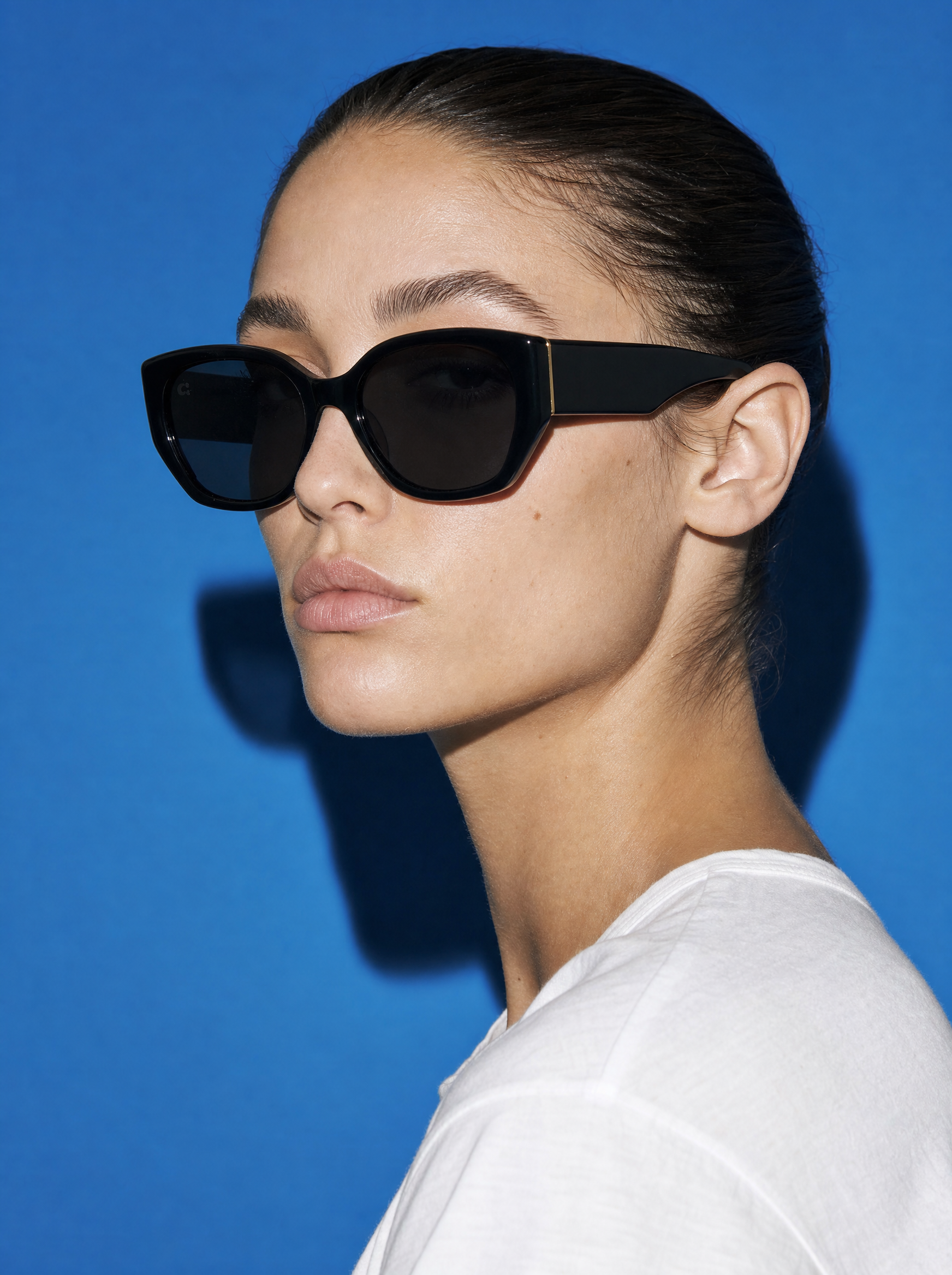 SLANT Frame 08 cat-eye sunglasses in NO COMMENT gloss black, three-quarter portrait