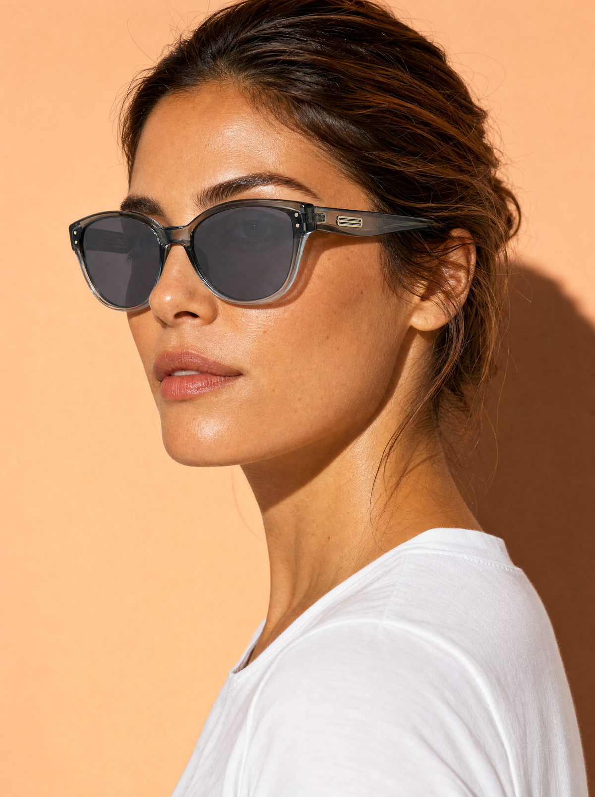 HM578 soft cat-eye sunglasses in STORM graduated teal-grey, three-quarter portrait