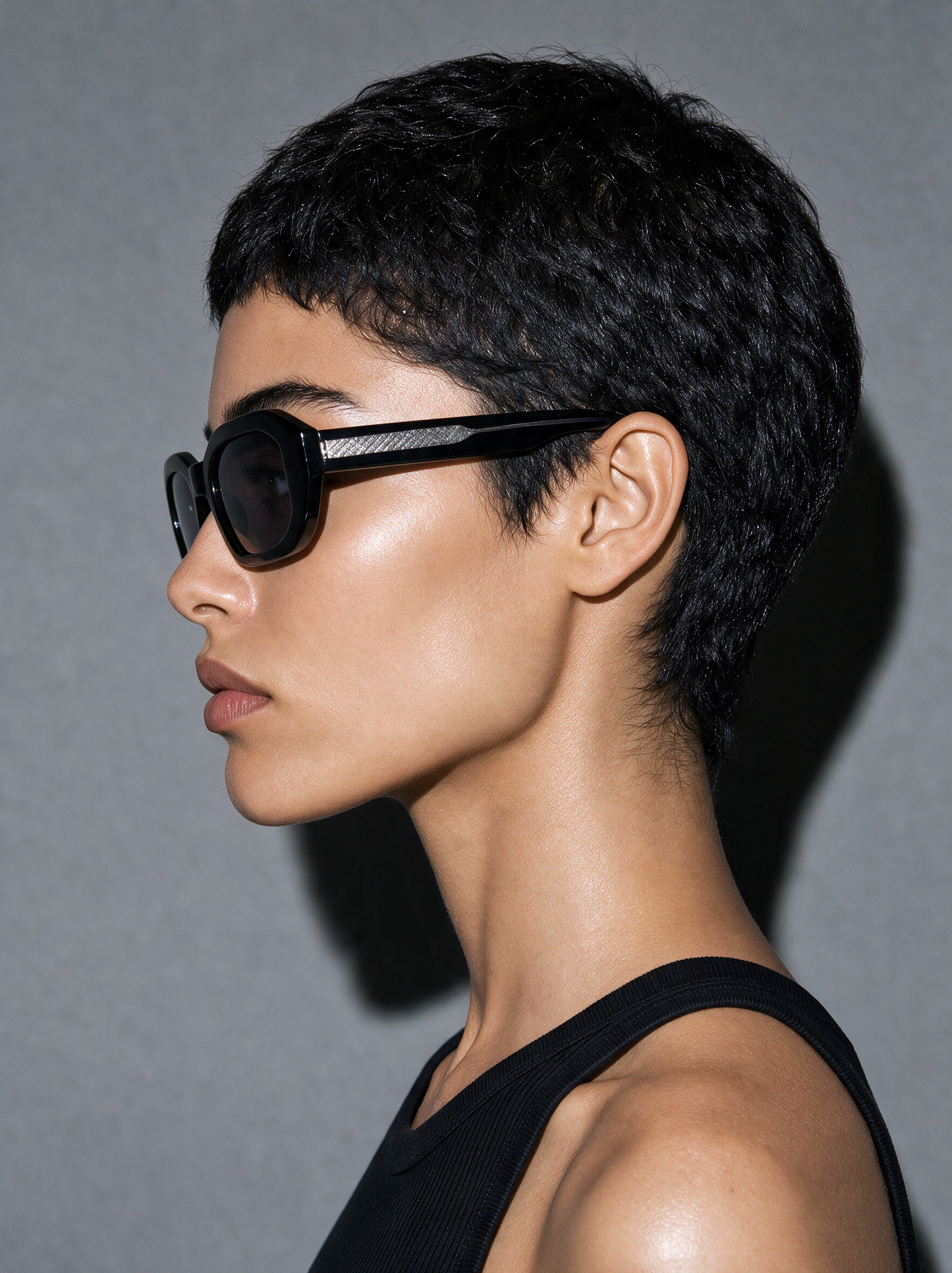 BEVEL VINYL - gloss black faceted octagon sunglasses, side profile showing mesh temple insert