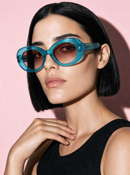 ORBIT Frame 21 oval sunglasses in CURACAO translucent blue, three-quarter portrait