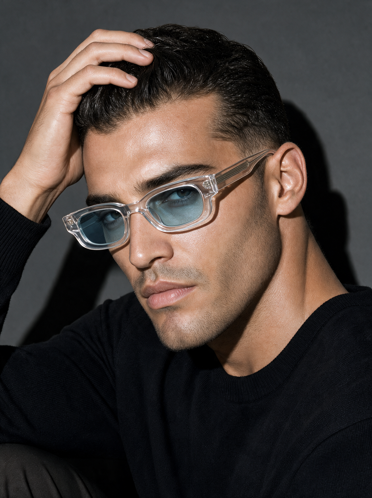 BLUNT Frame 13 sunglasses in ICE clear crystal with blue lenses, three-quarter portrait