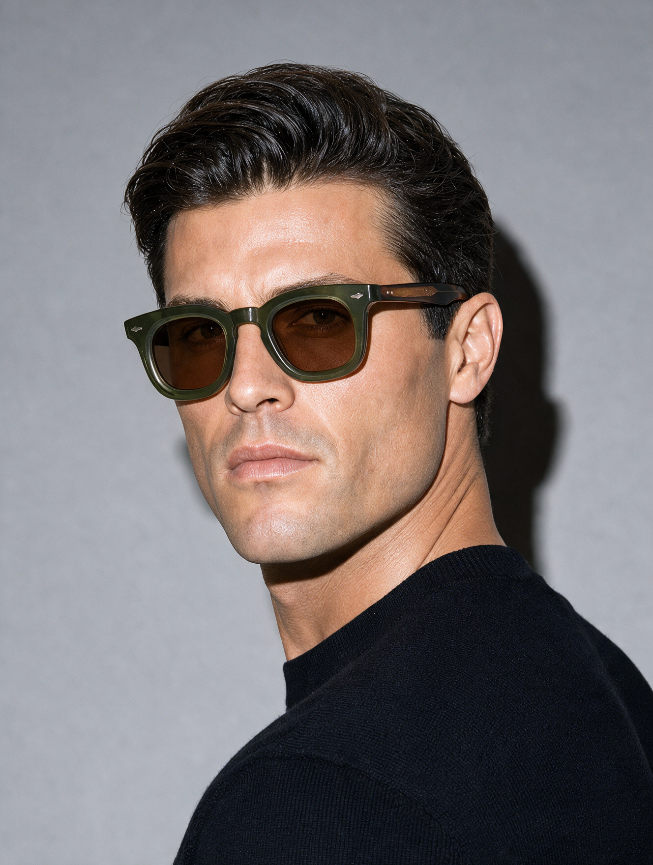 MASON Frame 10 sunglasses in OLIVE translucent olive-green acetate with figured amber temples, three-quarter portrait